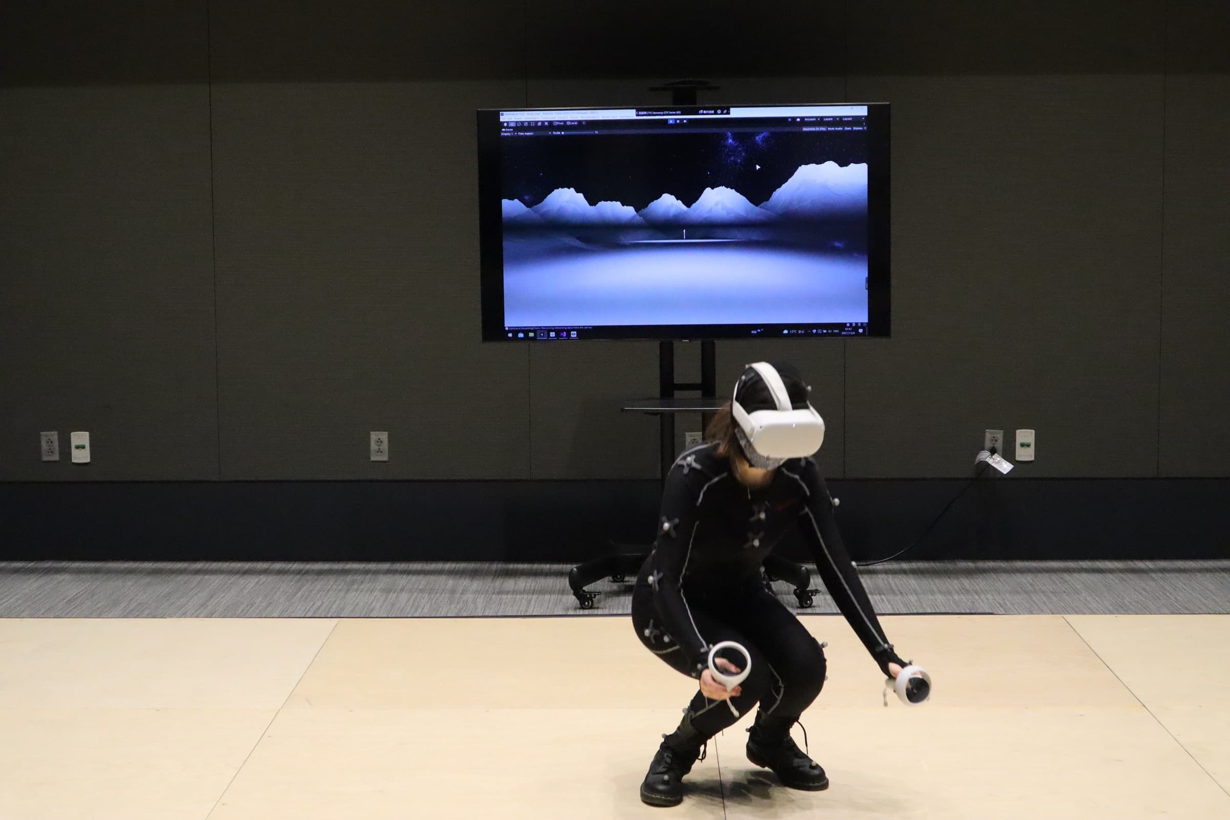 Participant meditating in VR with an EEG headband and headset.