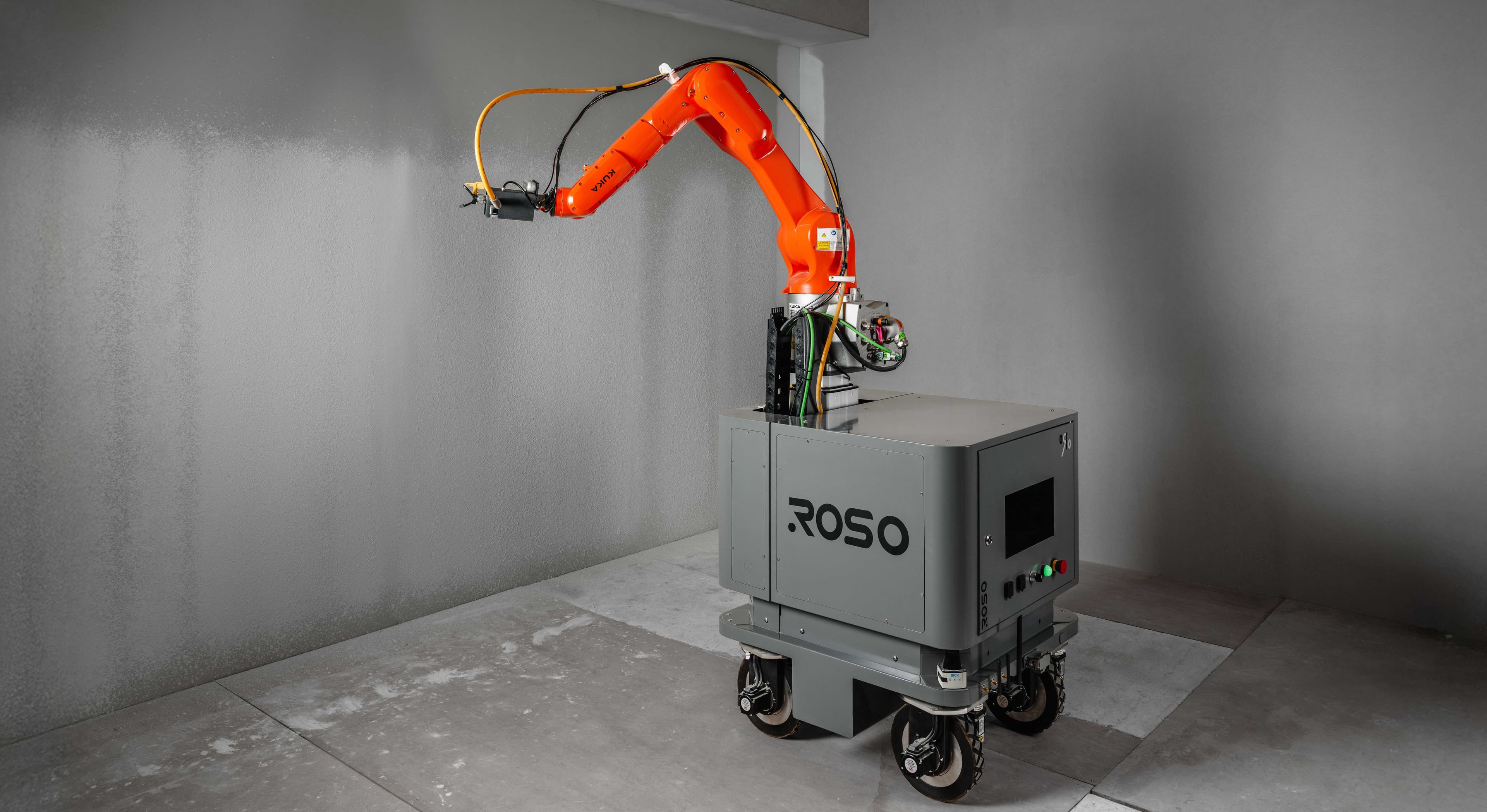 Detail view of a ROSO construction robot arm and mobile base.