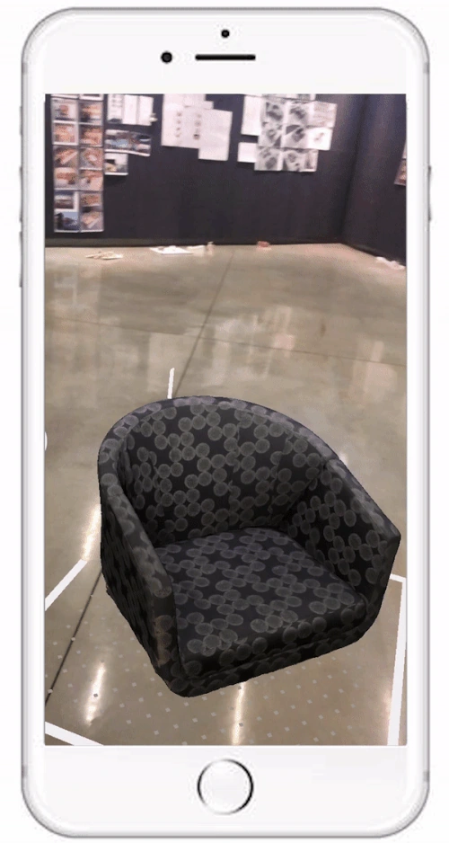 Early test: the scanned model placed at full scale in a real room through AR.